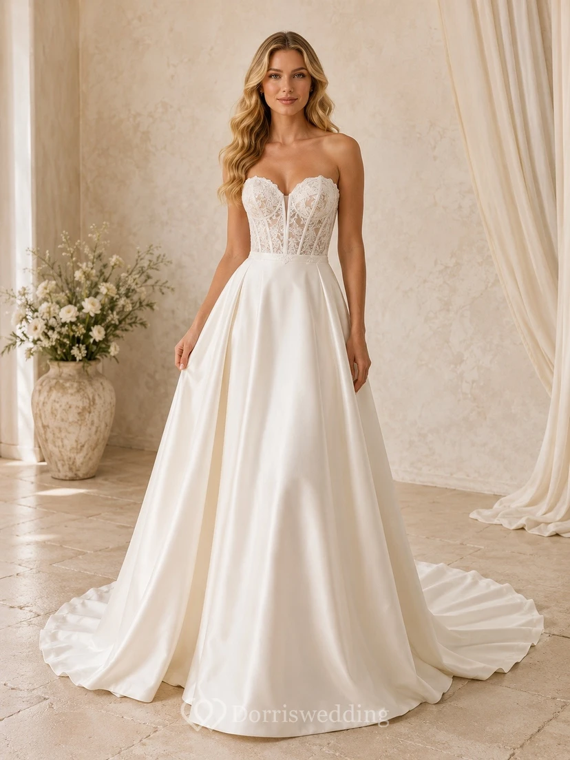 Vestido de novia sencillo sin tirantes, corte A, con corsé forrado de encaje y cola de corte princesa.