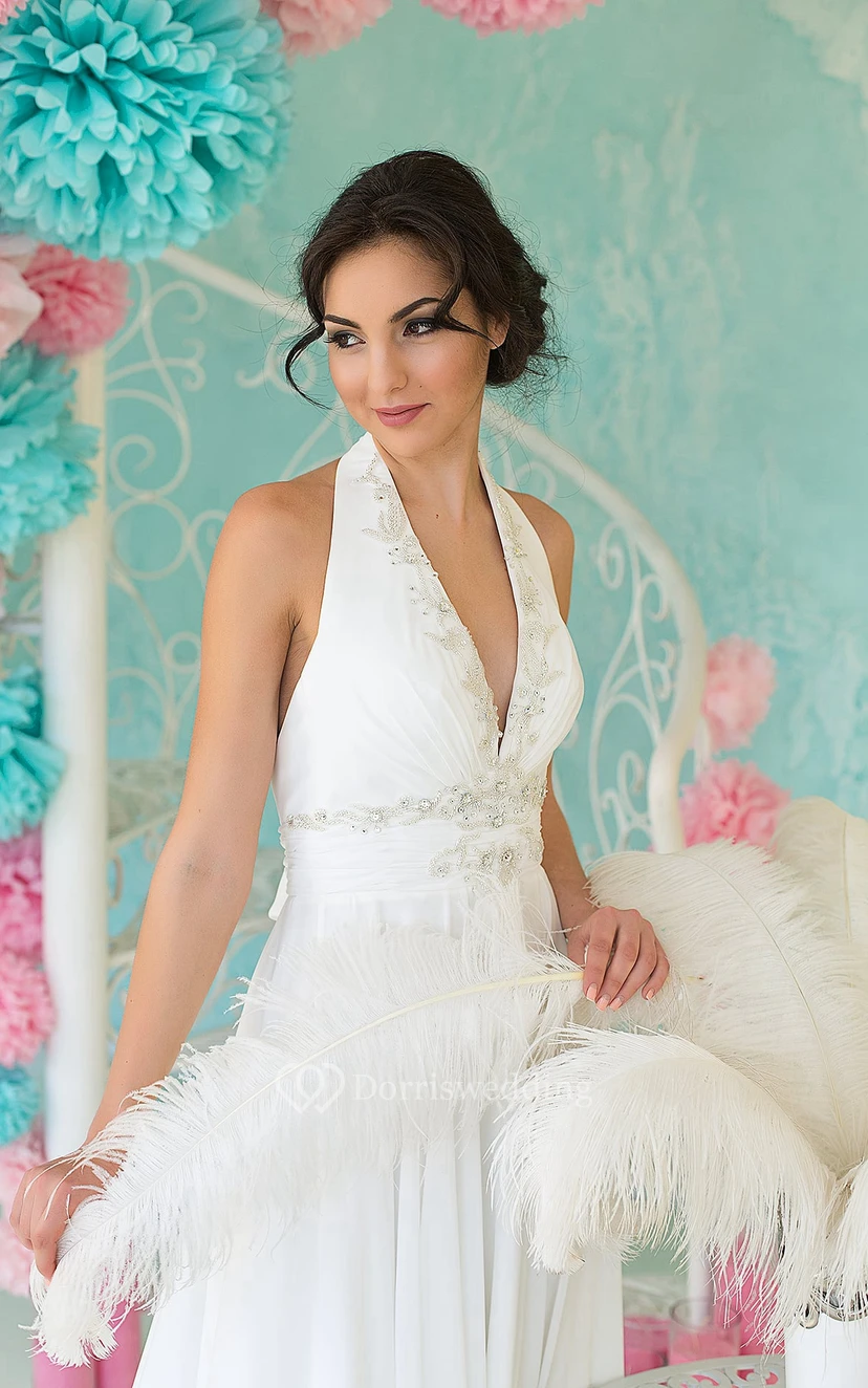 Vestido de gasa sin mangas, con escote halter y espalda descubierta, corte imperio, largo hasta el suelo, con abalorios y fruncido. view 2