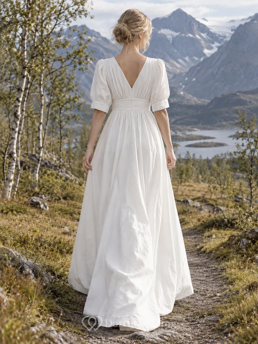 Vestido de novia de corte A estilo imperio en popelina de algodón con escote en V y mangas abullonadas con puños hasta el codo. view 2