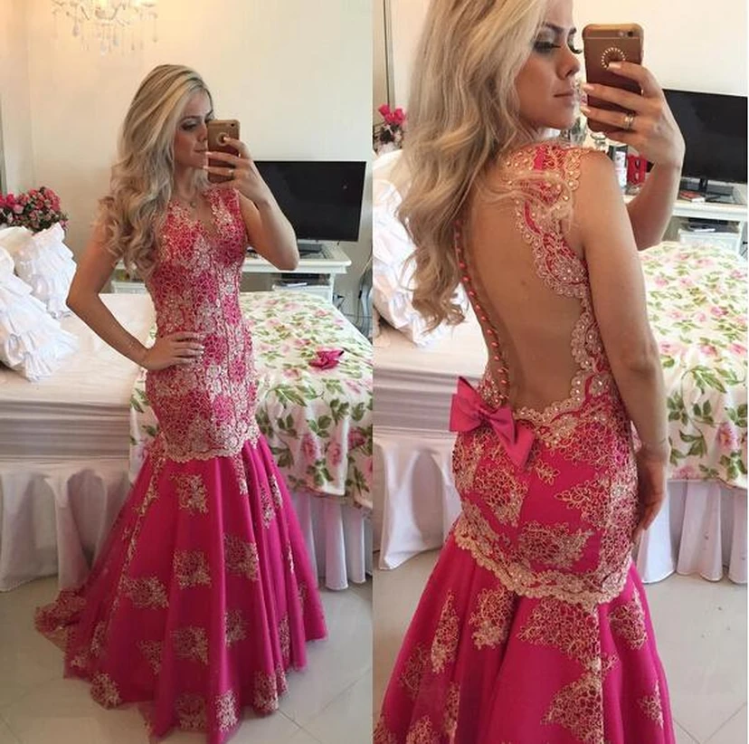 Robe de bal sirène fuchsia à traîne, ornée d'appliqués de dentelle chic et de sequins. view 2