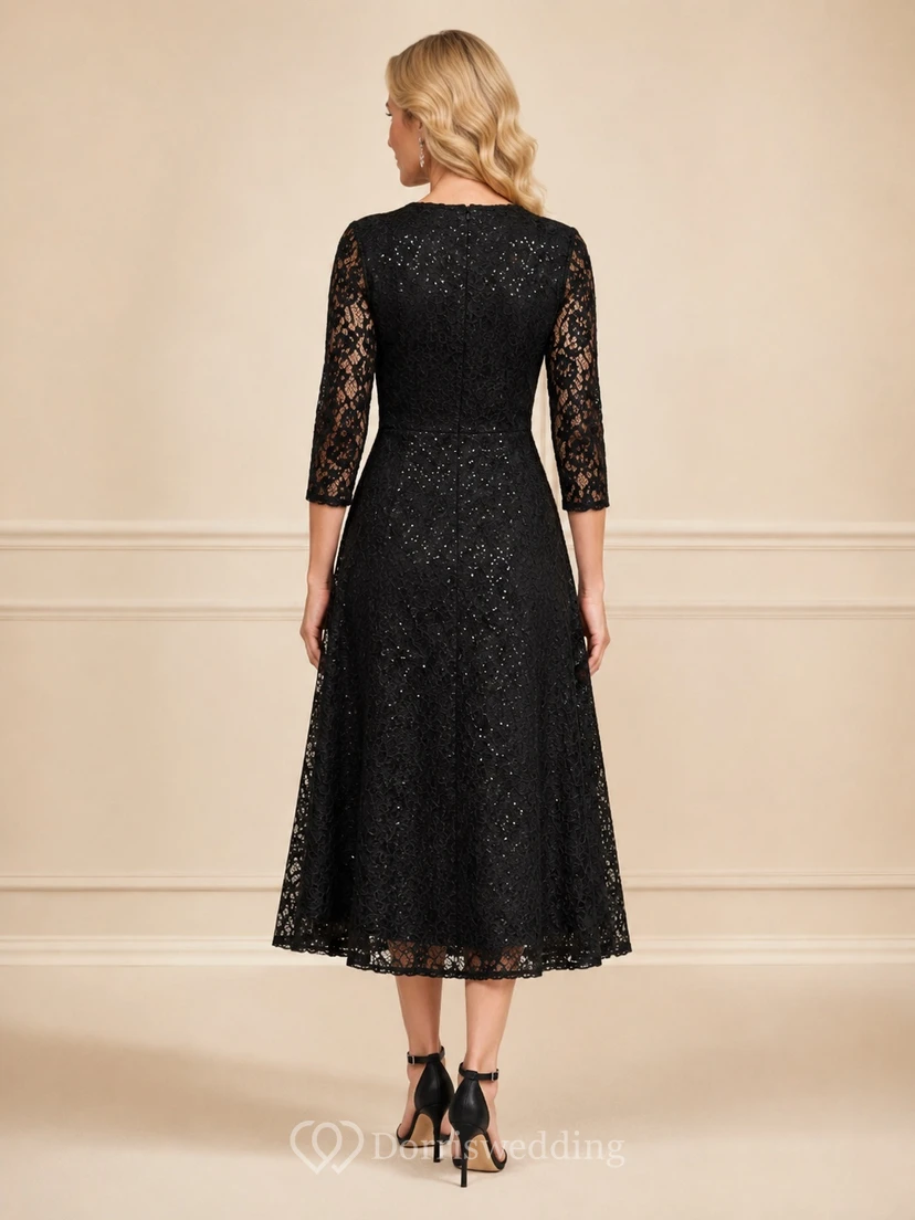 Vestido negro de corte A, encaje, escote en V, manga tres cuartos, largo midi, elegante y formal. view 2