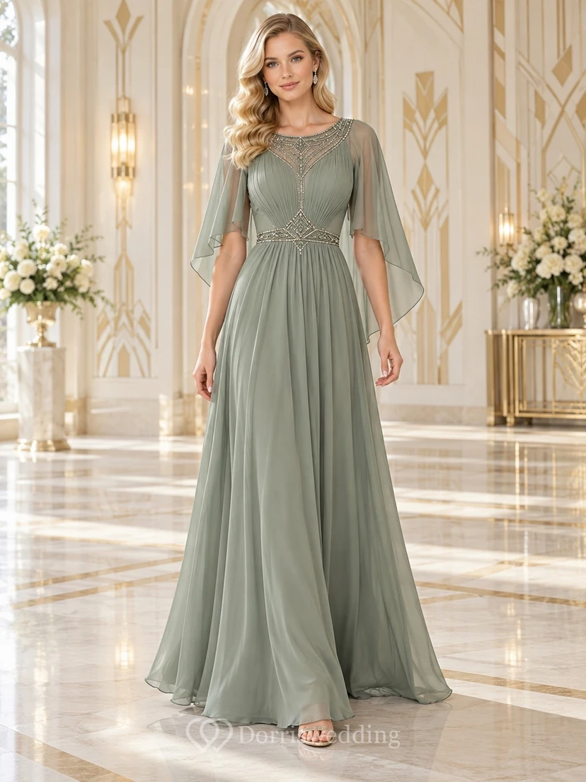Vestido largo de dama de honor vintage color verde salvia, corte en A, cuello joya, gasa, mangas tipo capa, con cuentas y fruncido.