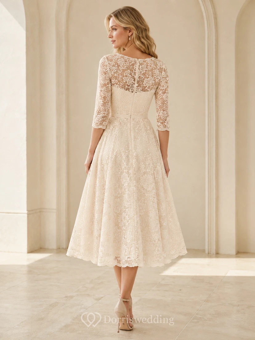 Robe de mariée mi-longue à manches trois-quarts, en dentelle florale, taille naturelle, coupe ajustée et évasée, dos illusion, décolleté bateau. view 2