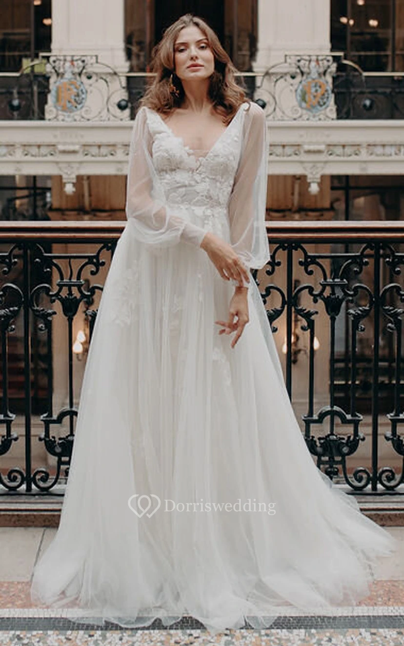 Vestido de novia bohemio de encaje, largo hasta el suelo, con cola, mangas largas, corte en A, espalda en V profunda y apliques.