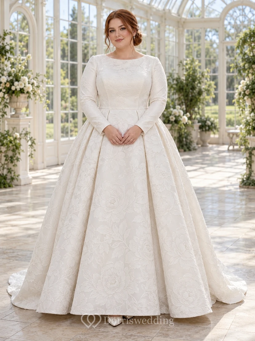 Vestido de novia discreto de manga larga con escote barco, estampado floral jacquard y falda plisada en línea A.