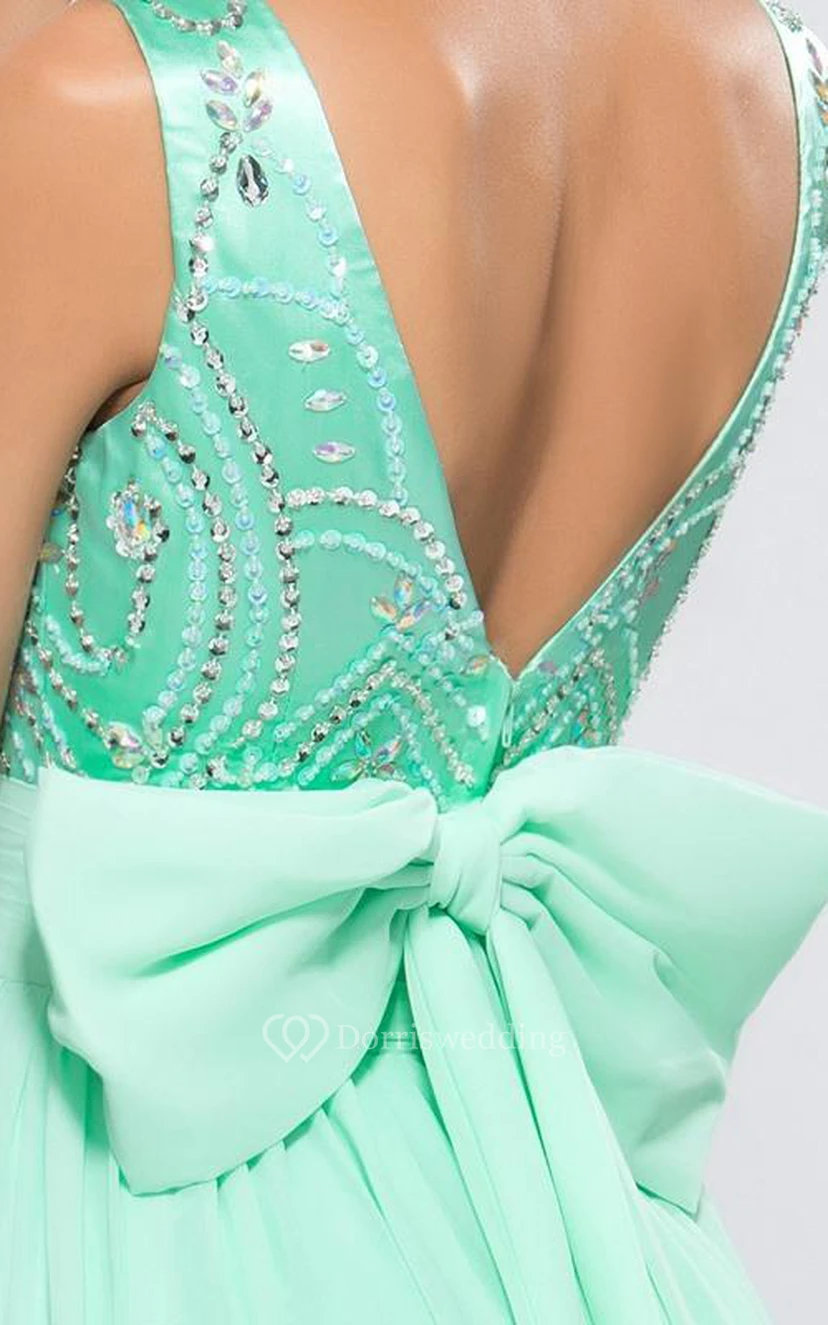 Vestido de fiesta sin mangas con escote barco y lazo, de corte A y con detalles de cuentas. view 8