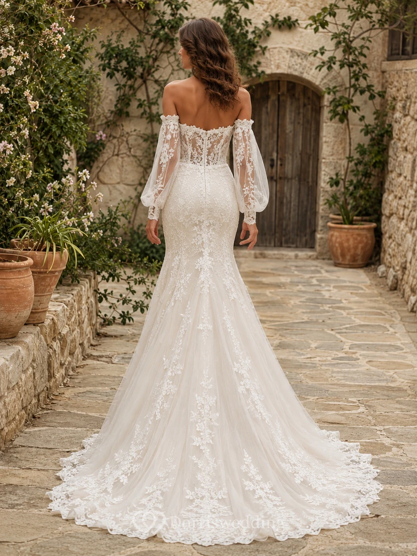 Vestido de novia bohemio de corte sirena con hombros descubiertos, mangas abullonadas de encaje y falda larga. view 2