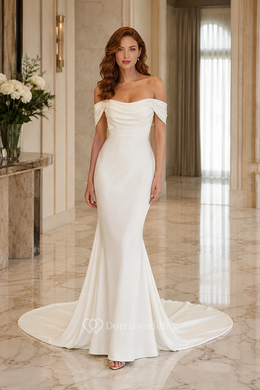 Robe de mariée sirène en satin, épaules dénudées et traîne.