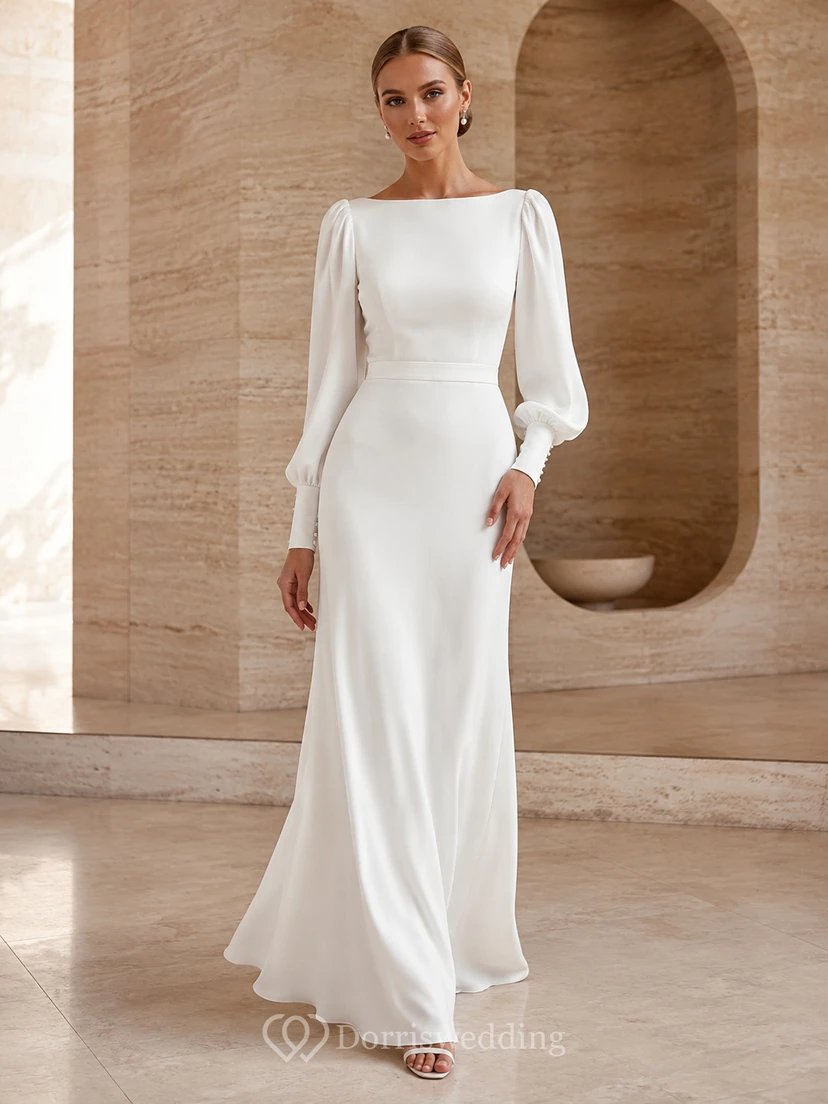 Robe de mariée fourreau en satin à manches bouffantes et coutures apparentes, style moderne et épuré.