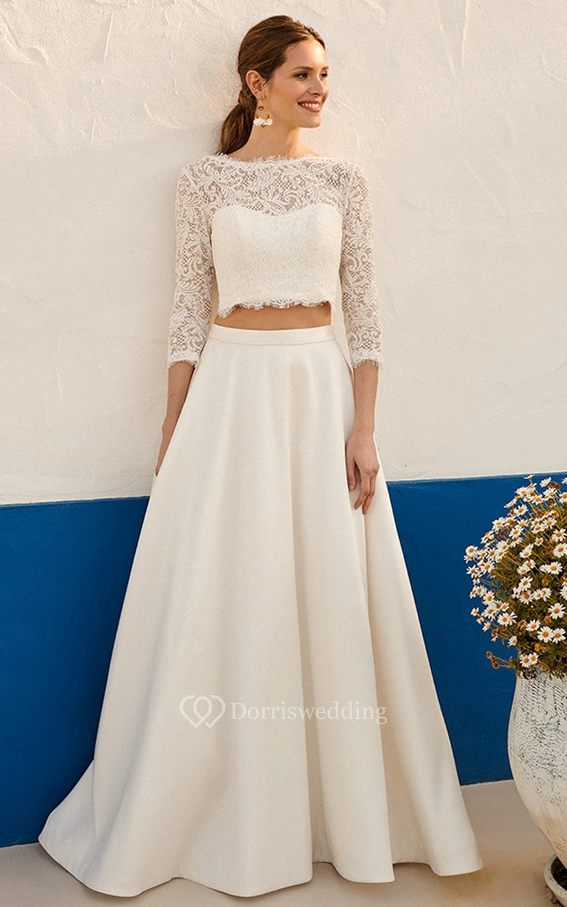 Robe de mariée élégante en dentelle deux pièces, longueur au sol, manches 3/4 et fronces.