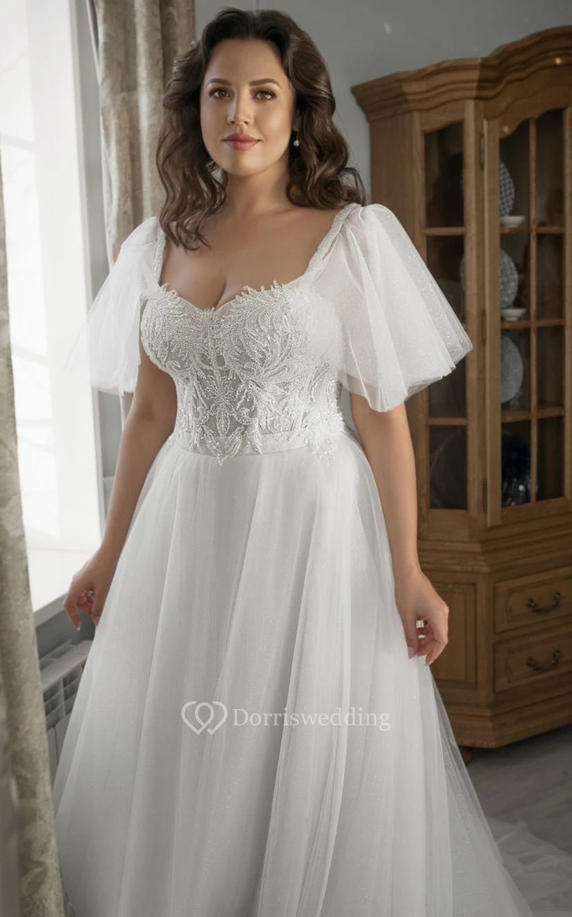 Robe de mariée princesse grande taille en tulle, coupe trapèze, manches courtes cloche, ornée de perles view 3