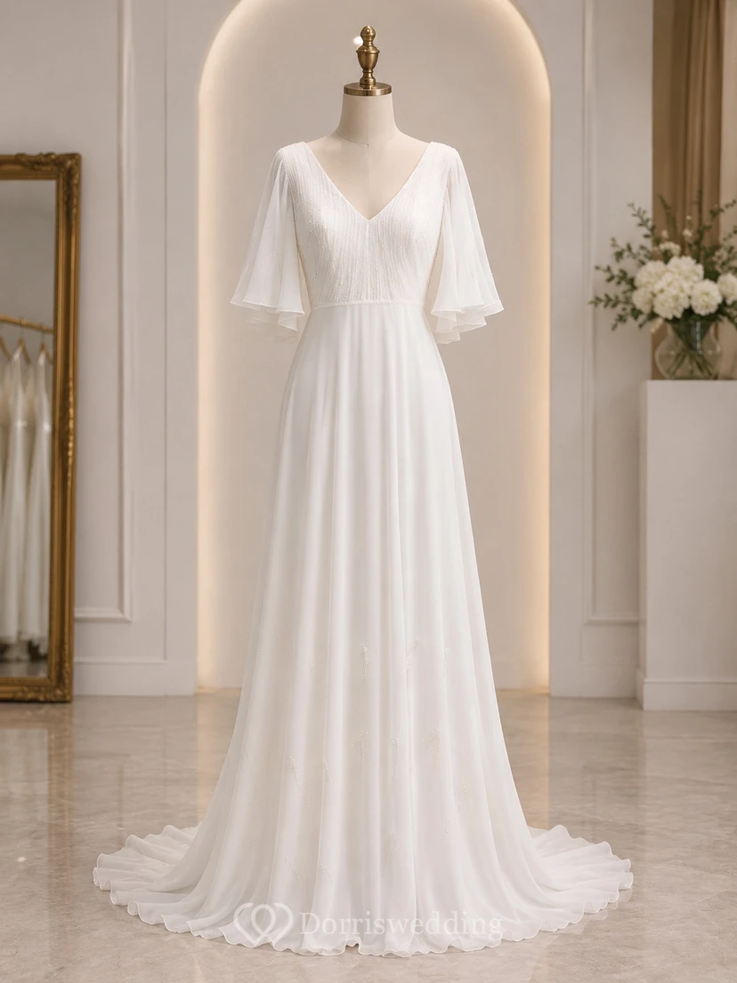 Vestido de novia de gasa con escote en V y mangas tres cuartos, estilo imperio. view 7