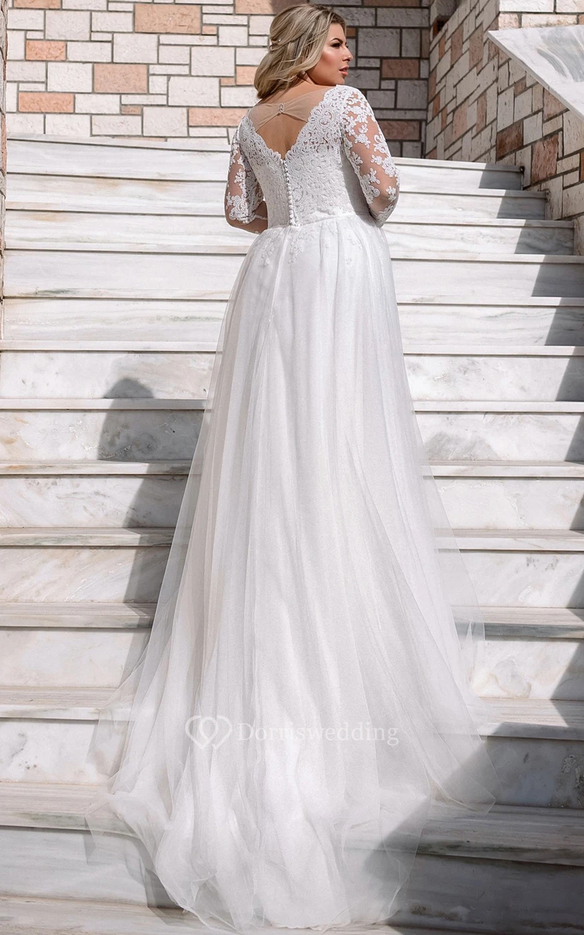Robe de mariée moderne en dentelle, coupe trapèze, manches longues, longueur au sol, ornée d'appliqués view 2