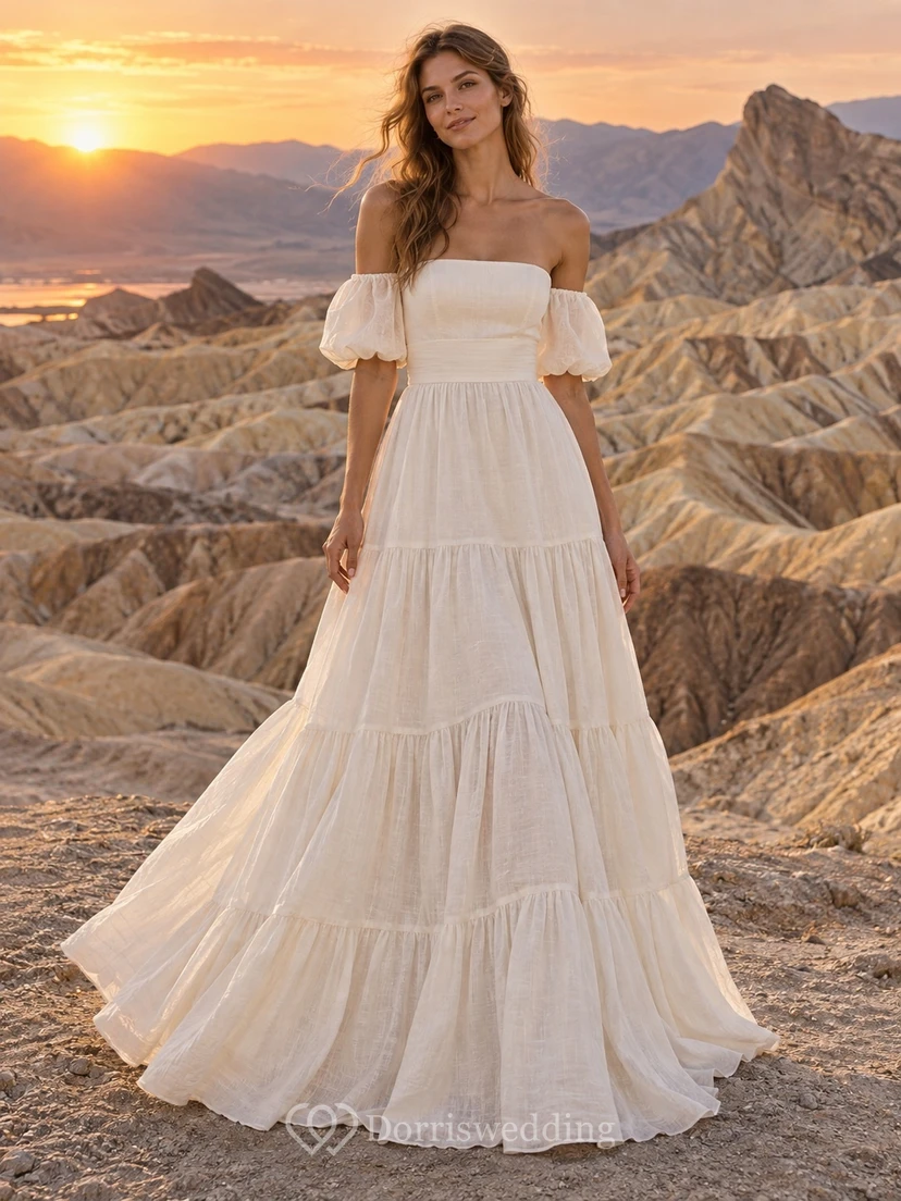 Vestido de novia sencillo de manga corta con escote Bardot y falda escalonada, confeccionado en lino, corte en A y largo hasta el suelo.