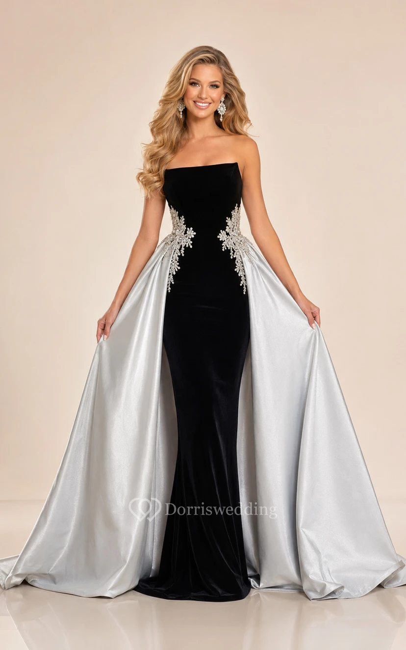 Vestido formal negro de terciopelo sin tirantes con sobrefalda extraíble de satén blanco.