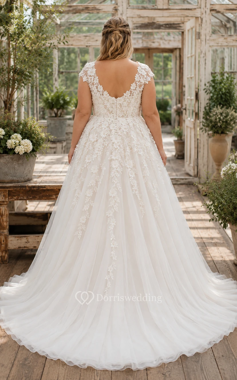 Robe de mariée grande taille ivoire à manches courtes en dentelle et jupe en tulle view 2